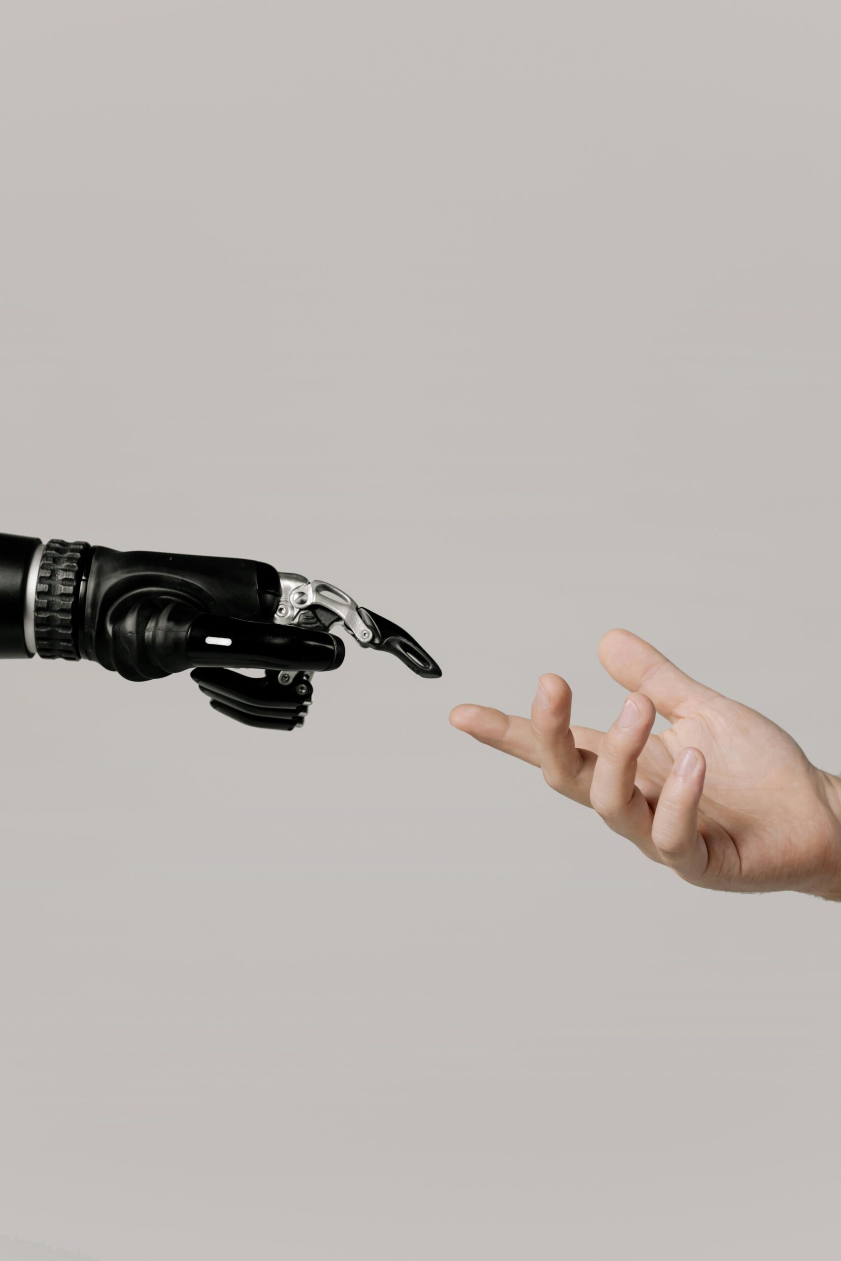 Image of robot hand and human hand coming together