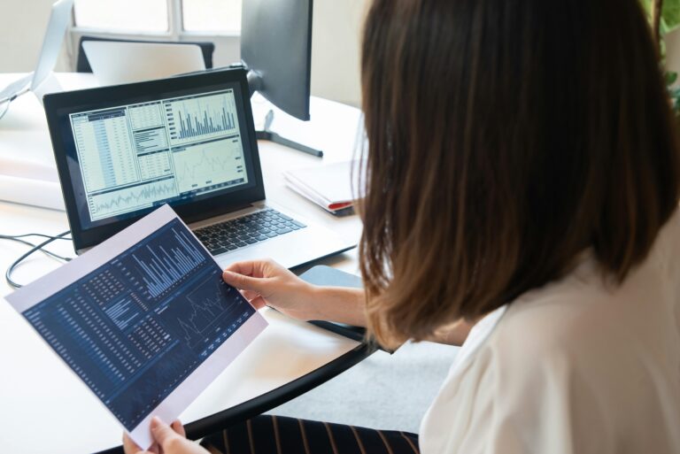 Photo of business person looking at charts