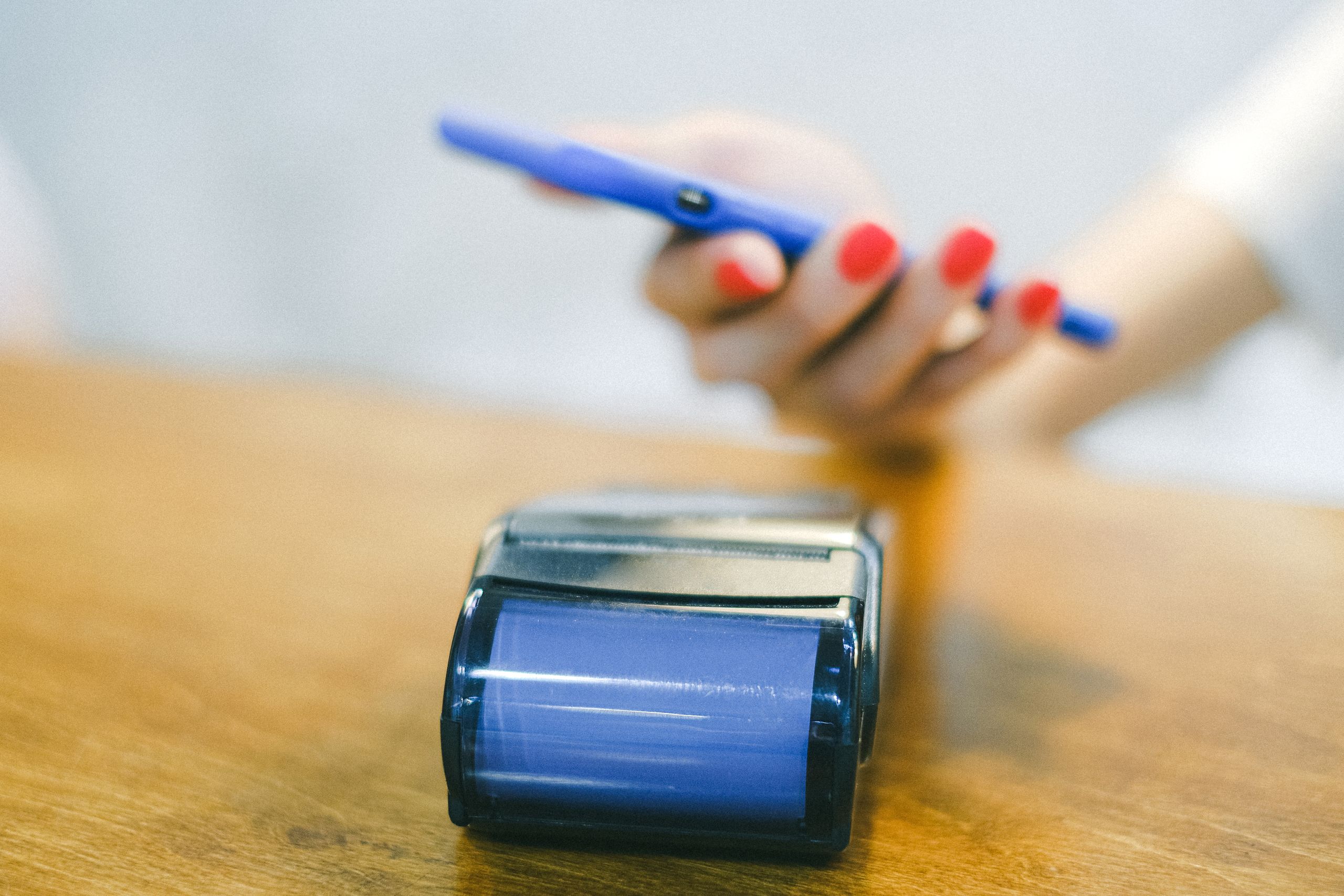 Photo of a person paying with a smartphone
