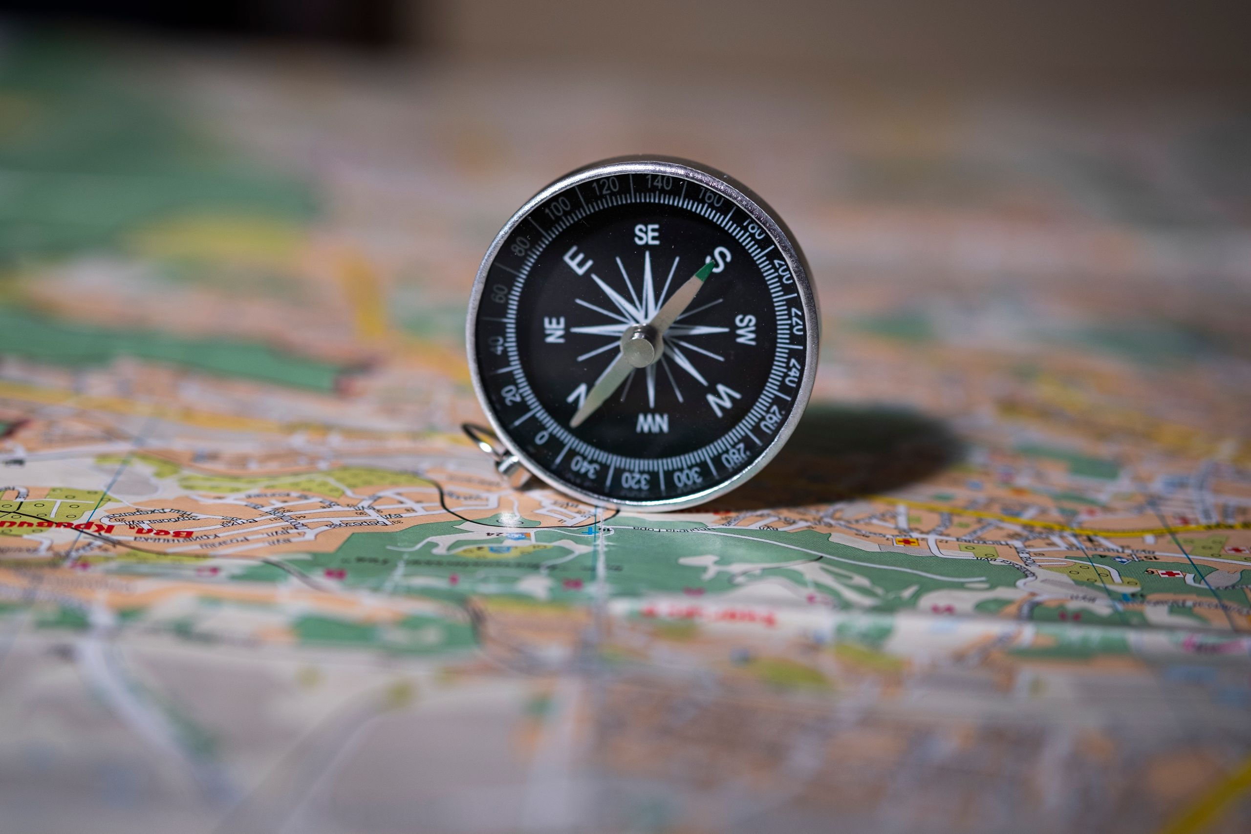Photo of a compass on a map